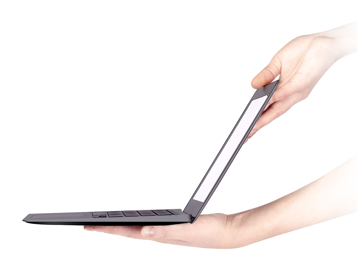 Close-up image of a open laptop being held by a person. 